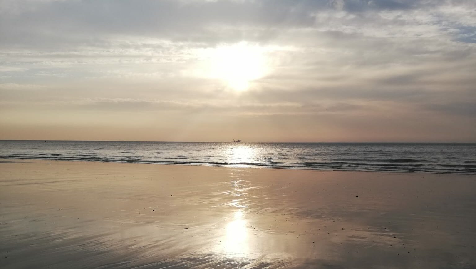 Soft sunset reflecting across the sea, symbolising quiet possibility, and gentle reconnection.